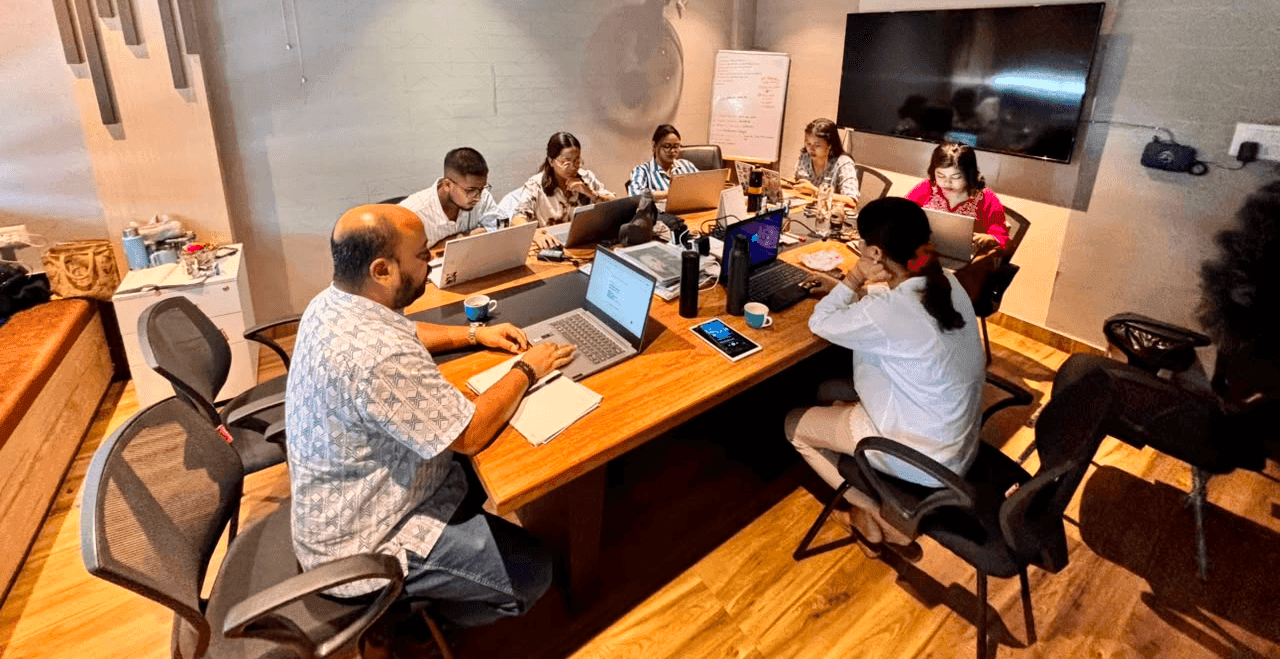 The Fusion Edge Solutions team collaborating around a meeting table